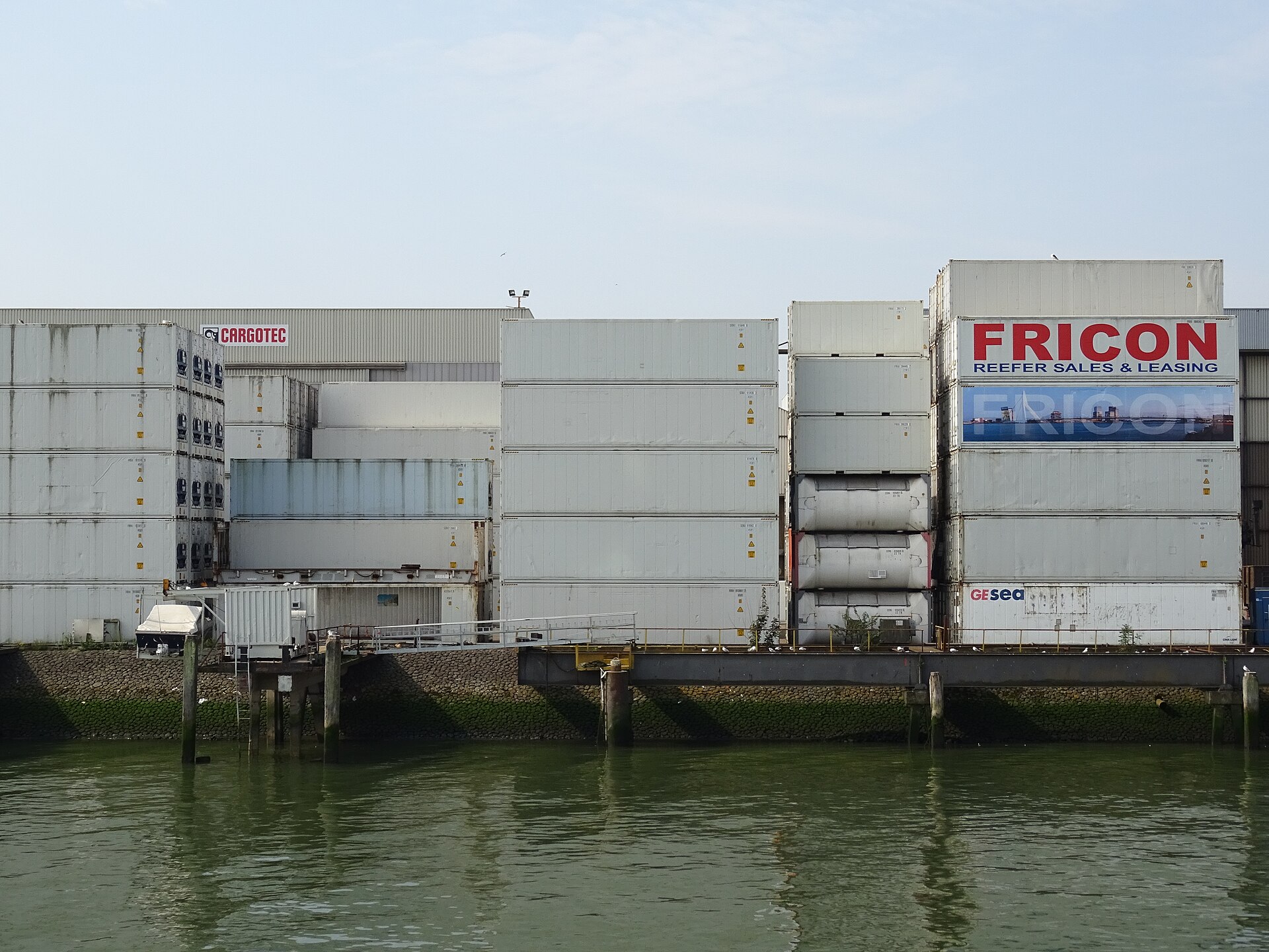 Shipping containers stacked in rows at the Port of Rotterdam.