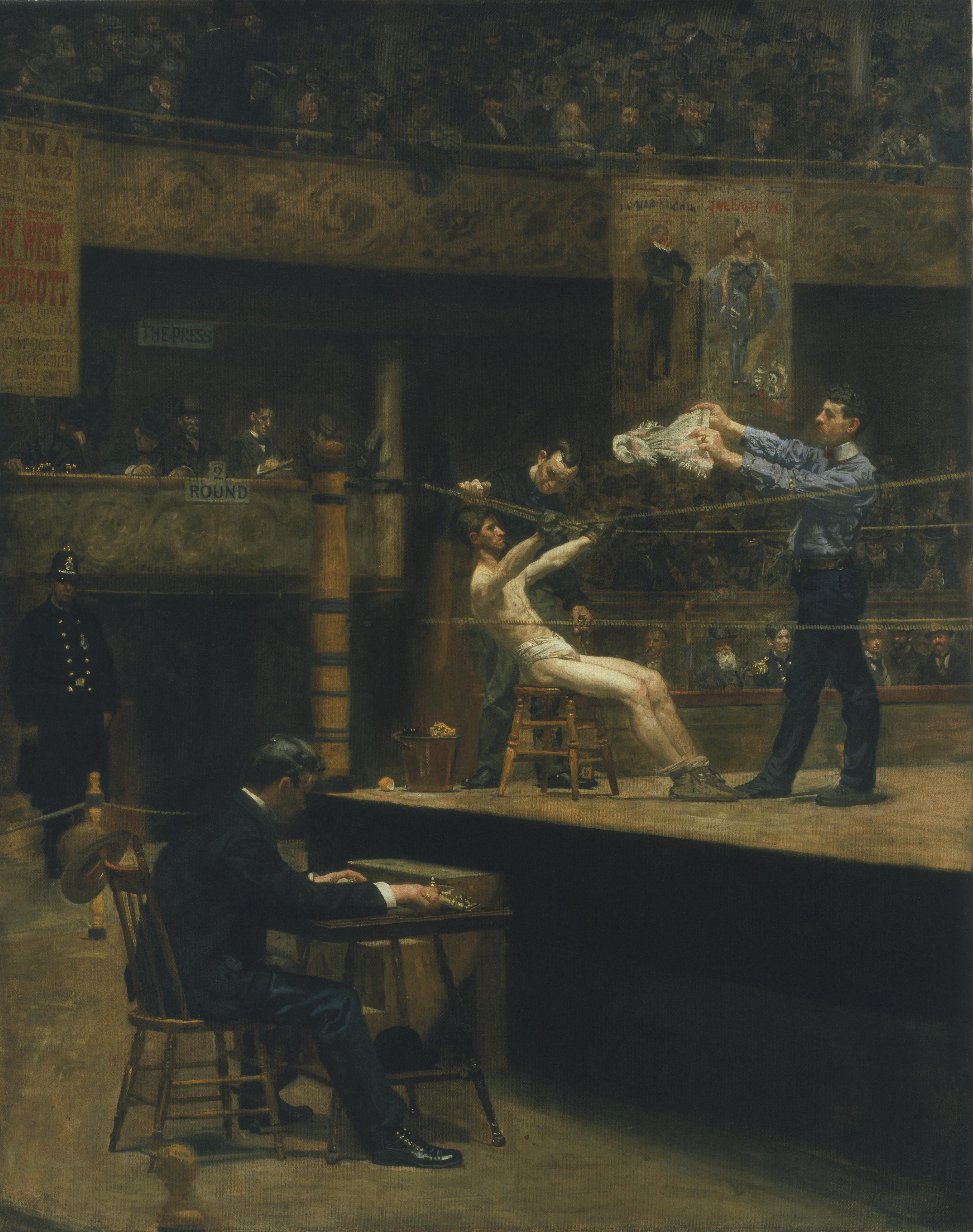 Thomas Eakins’s painting of a boxer resting on a stool between rounds while his corner tends to him and a crowd watches from the dark arena.
