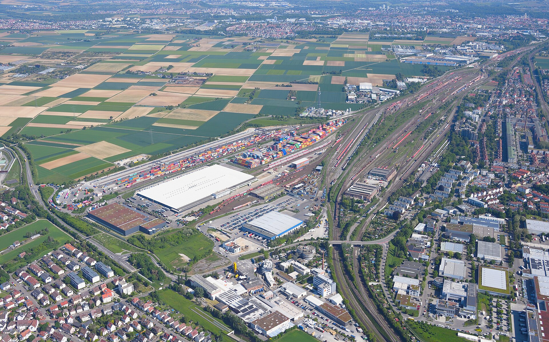 Aerial photograph of a classification yard where dozens of rail tracks fan out from a single hump before converging again.